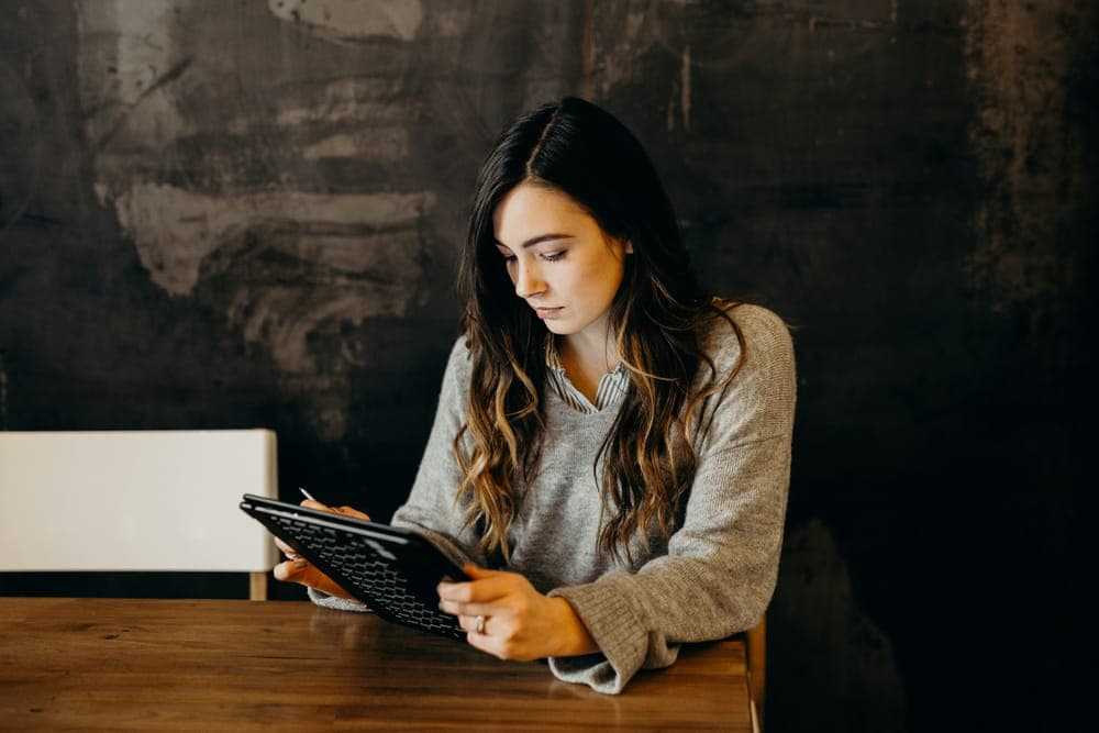 A woman working on a tablet