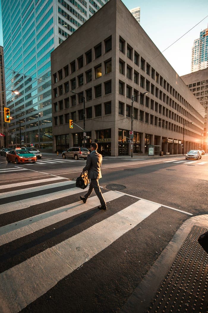 A woman walking through a bright office