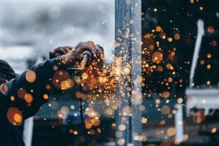 Sparks flying from a welding torch